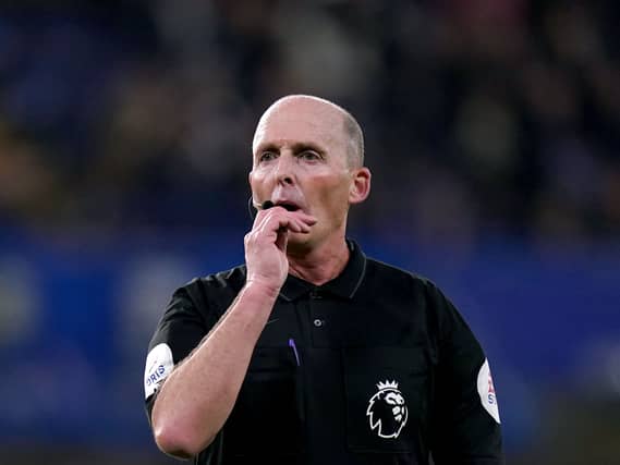 Referee Mike Dean pictured officiating a Chelsea v Brighton match