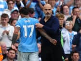 Manchester City midfielder Enzo Fernandez with manager Enzo Maresca