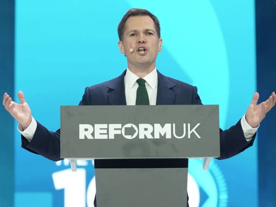 Robert Jenrick speaking from behind a Reform UK lectern