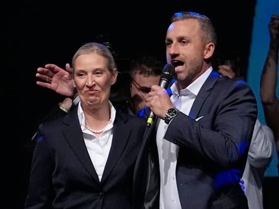 Ulrich Siegmund speaks beside party leader Alice Weidel at an election party for the Alternative for Germany (AfD) after the Saxony-Anhalt state elections in Magdeburg, eastern Germany on Sunday
