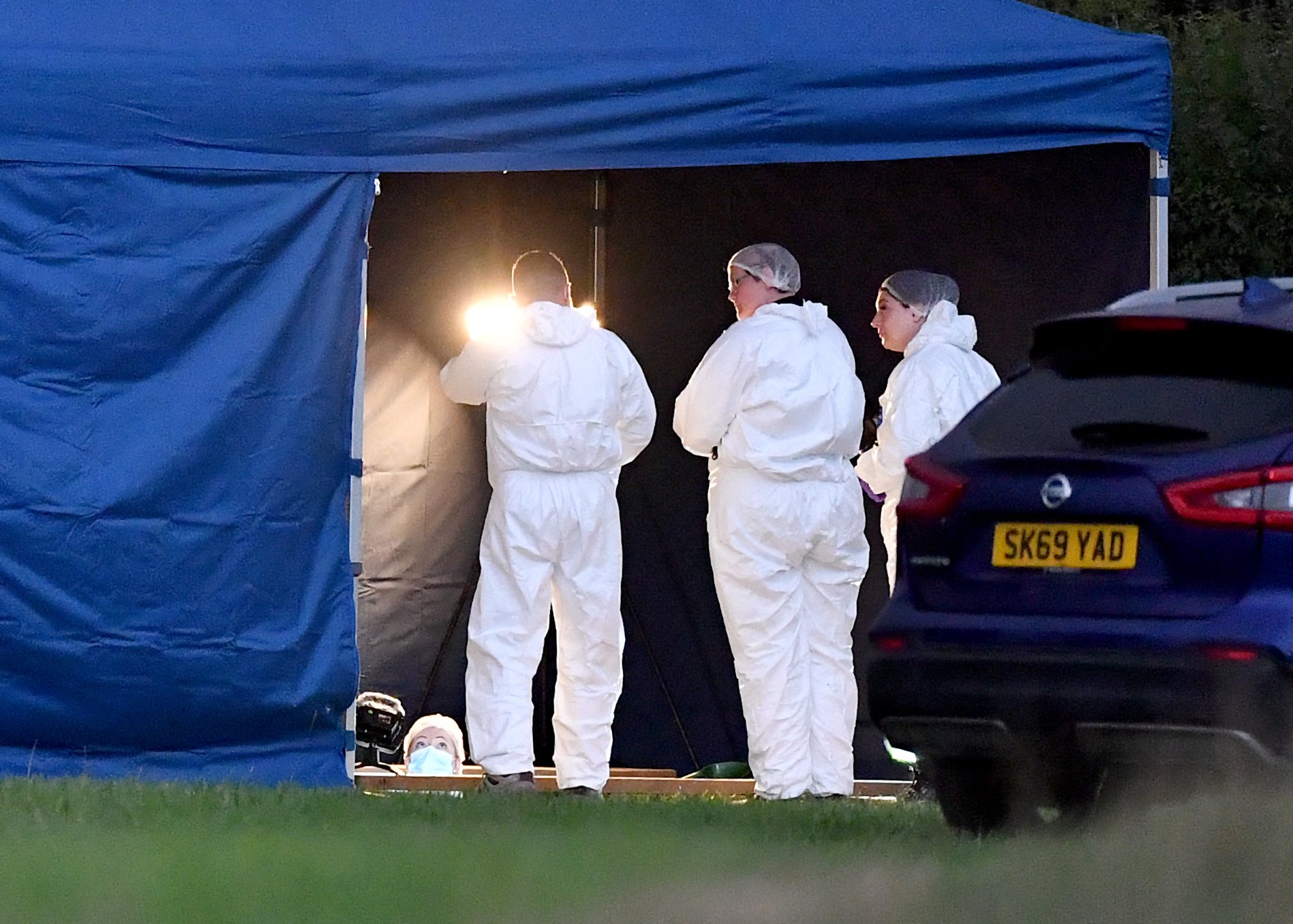 Investigators dig up grave at West Midlands site as detectives probe 'unexplained' death of woman