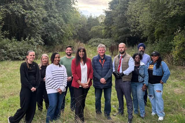 Sureena Brackenridge MP and Chris Allen, centre, with members of the Low Hill community