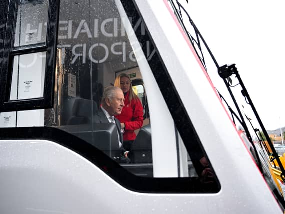 King takes the controls of a tram-train officially named Myddfai at the official opening of the South Wales Metro Depot in Taff’s Well, during a visit to South Wales to celebrate the King’s 77th birthday on November 14 2025