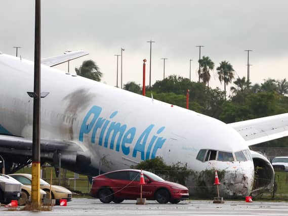 An Amazon cargo plane sits at Miami International Airport after overshooting a runway on Monday