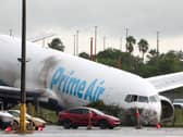 An Amazon cargo plane sits at Miami International Airport after overshooting a runway on Monday