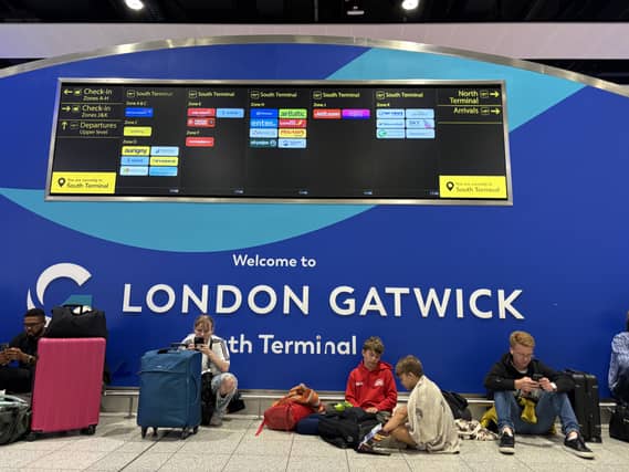 Passengers at Gatwick Airport’s South Terminal in Crawley, West Sussex, after flights were cancelled on Tuesday