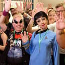 Star Trek fans posing doing the Vulcan salute at the Science Museum