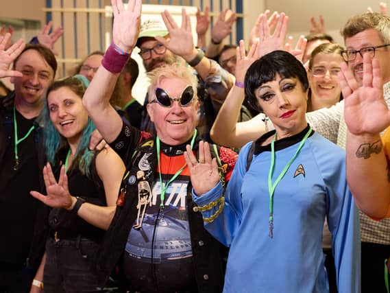 Star Trek fans posing doing the Vulcan salute at the Science Museum