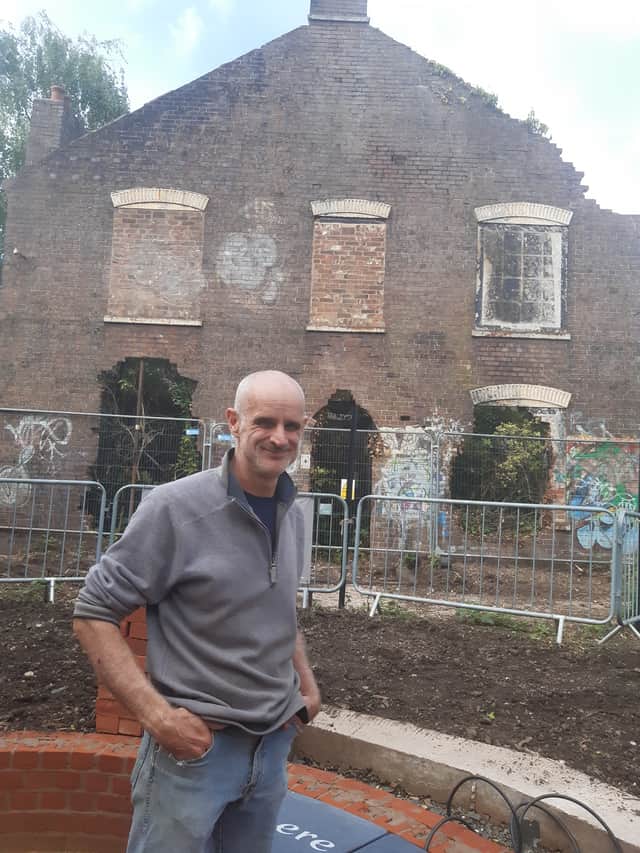 Lloyd Stacey standing in front of Riverside House