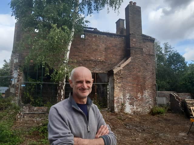 Riverside House director Lloyd Stacey in front of the Grade II-listed original ironmaster's house which  can now be seen on the site