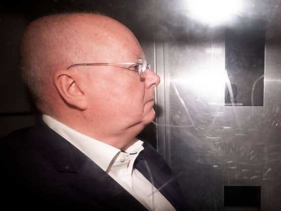 Peter Murrell pictured in the back of a prison van