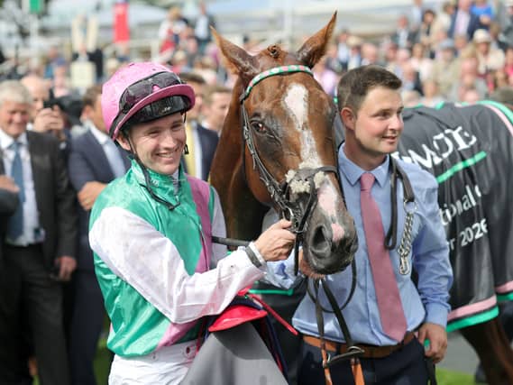 Jockey Colin Keane with Item after winning the Juddmonte International