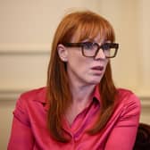Angela Rayner seated, wearing glasses and a pink shirt