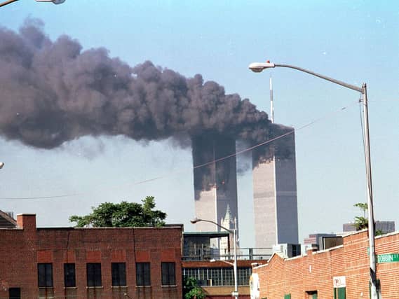 The Twin Towers with smoke belching out of them