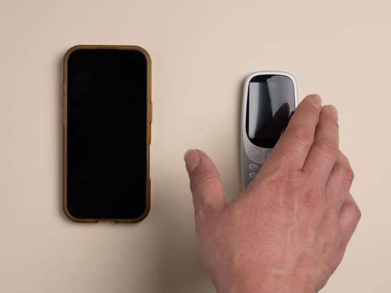 A hand on a phone