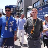 Morgan Rogers, left, and Cole Palmer in the pit lane before the Spanish Grand Prix