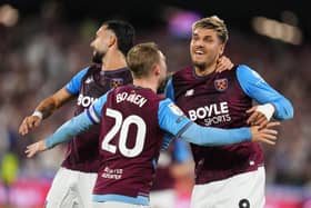 Joel Piroe, right, Taty Castellanos, left, and Jarrod Bowen celebrate
