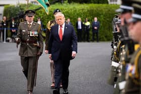 Donald Trump inspects a guard of honour during his visit to Dublin