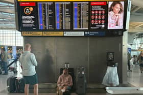 Passengers at Heathrow Airport in west London during disruption after a system issue hit air traffic provider Nats