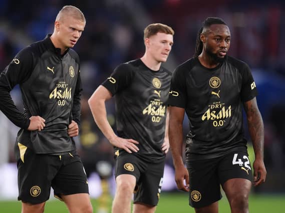 Erling Haaland, left, and Elliot Anderson, centre, have started the season well for City