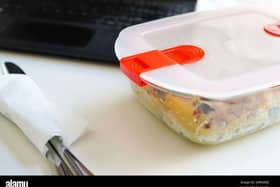 Lunch with pasta in Tupperware at the office desk