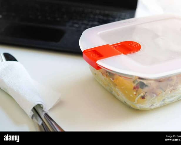 Lunch with pasta in Tupperware at the office desk