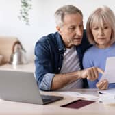 An older couple looking at paperwork