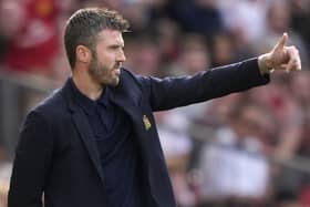 Michael Carrick gestures on the touchline at the Manchester derby