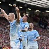Erling Haaland celebrates the winner in the Manchester derby at Old Trafford