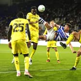 Reading’s Paudie O’Connor, centre, scores with a bicycle kick before the goal is ruled out