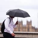 Man holding an umbrella