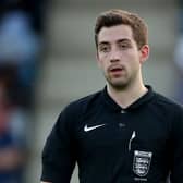 Blake Antrobus pictured refereeing a pre-season friendly between Telford and Aston Villa