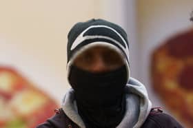 A male wearing a face covering in the centre of Nottingham