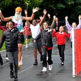 Fundraiser Manny Singh Kang joins pupils at Hill Avenue Academy, Wolverhampton to run a mile around the playground. Manny is visiting 50 schools in two days.
Tim Thursfield/Iconic Media Group