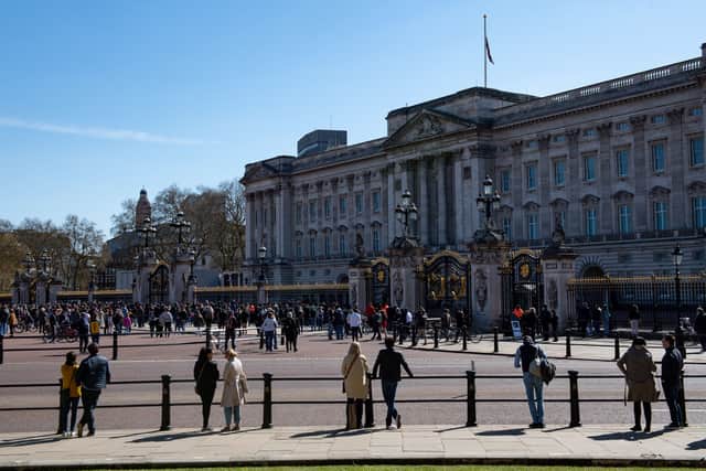 People observe the national minute’s silence outside Buckingham Palace (Jacob King/PA)[caption id="2.59237571" align="alignnone" width="3500"] Scenes outside Buckingham Palace as the funeral got under way (Jacob King/PA)