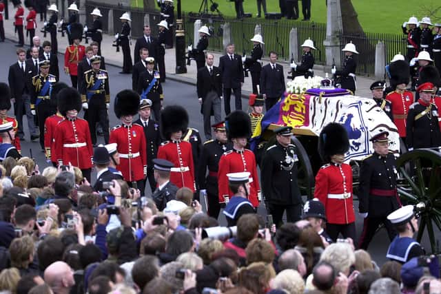 The armed forces and the royal family take part in the procession of the Queen Mother’s coffin in 2002 (Stefan Rousseau/PA)