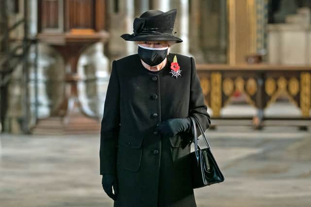 The Queen in a face mask in London’s Westminster Abbey last year (Aaron Chown/PA)