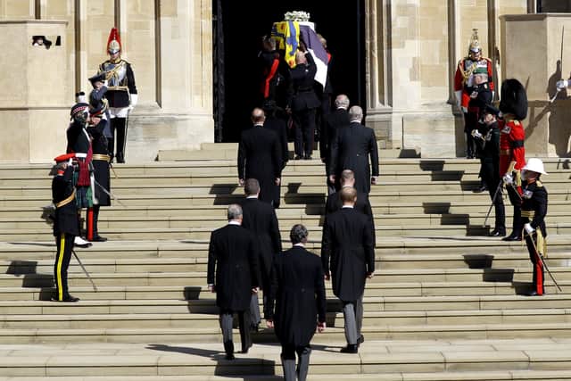 The Duke of Edinburgh’s coffin is taken into the chapel, followed by members of his family (Kirsty Wrigglesworth/PA)