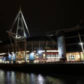 Exterior view of the Principality Stadium lit up for an evening fixture in the Six Nations