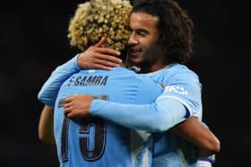 Floyd Samba (left) celebrates with team-mate Ayyoub Bouaddi