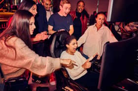 People enjoying a watch party at F1 Arcade