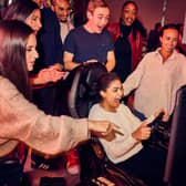 People enjoying a watch party at F1 Arcade