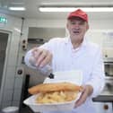 Liberal Democrat leader Sir Ed Davey serving up fish and chips at Brighton Palace Pier