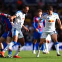 Crystal Palace’s Adam Wharton (left) and Leeds’ Dominic Calvert-Lewin battle for the ball