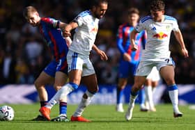 Crystal Palace’s Adam Wharton (left) and Leeds’ Dominic Calvert-Lewin battle for the ball