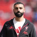 Mohammed Salah wearing a Liverpool tracksuit