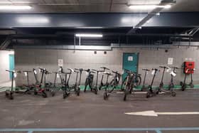 E-scooters and e-bikes seen in a row after being seized by police as part of a crackdown across Belfast