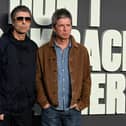 Liam and Noel Gallagher posing for photos