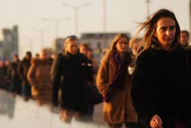 People walking across a bridge