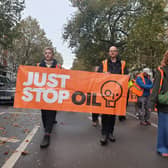 Jamie Russell, right, taking part in the protest on November 1, 2023.